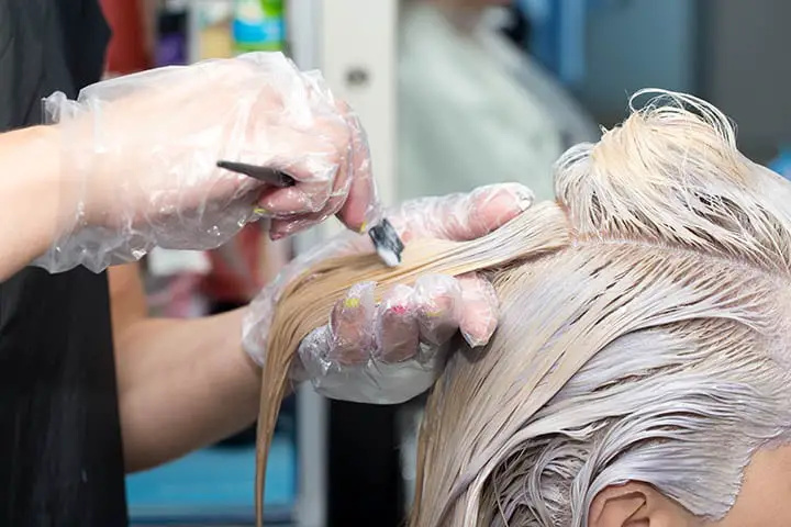 What happens if you apply a dark permanent hair dye over bleached hair