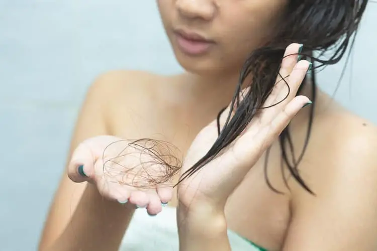 Women suffering from hair falling when shampooing