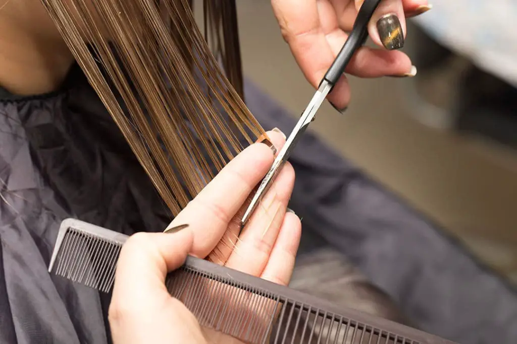 Girl trimming split ends