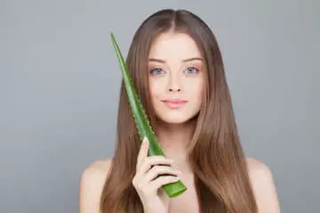 Girl wondering if it's safe to sleep with aloe vera on her face