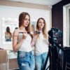 Two girls doing a flawless makeup for a photo shoot