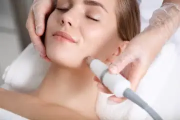 A beautiful girl getting a laser hair removal on her face